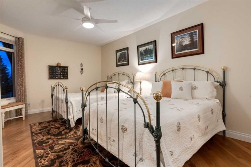 100-274256 272 Street West, Rural Foothills County, AB - Indoor Photo Showing Bedroom