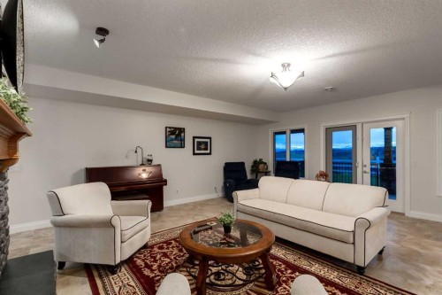 100-274256 272 Street West, Rural Foothills County, AB - Indoor Photo Showing Living Room