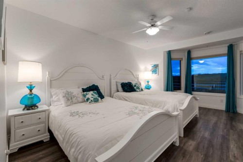 100-274256 272 Street West, Rural Foothills County, AB - Indoor Photo Showing Bedroom