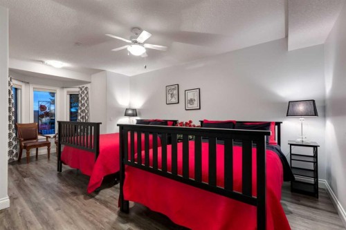 100-274256 272 Street West, Rural Foothills County, AB - Indoor Photo Showing Bedroom