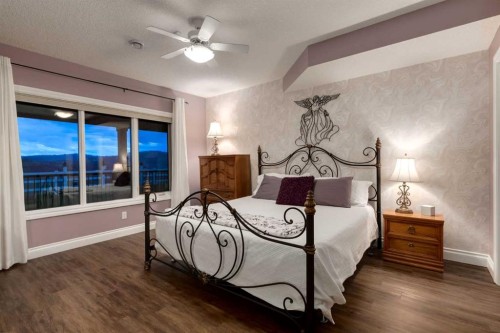 100-274256 272 Street West, Rural Foothills County, AB - Indoor Photo Showing Bedroom