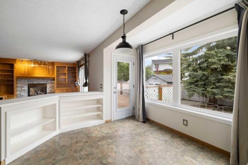439 Douglas Woods Drive Se, Calgary, AB - Indoor Photo Showing Other Room With Fireplace