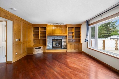 439 Douglas Woods Drive Se, Calgary, AB - Indoor Photo Showing Other Room With Fireplace