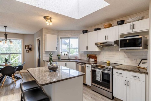 79 West Lakeview Passage, Chestermere, AB - Indoor Photo Showing Kitchen With Upgraded Kitchen