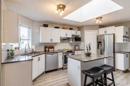 79 West Lakeview Passage, Chestermere, AB - Indoor Photo Showing Kitchen With Stainless Steel Kitchen With Double Sink With Upgraded Kitchen