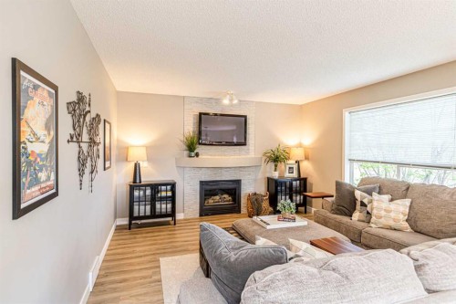 79 West Lakeview Passage, Chestermere, AB - Indoor Photo Showing Living Room With Fireplace