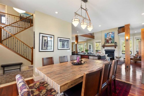 7 Discovery Ridge Cove Sw, Calgary, AB - Indoor Photo Showing Dining Room With Fireplace