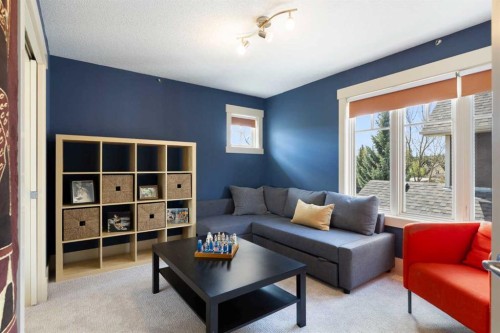 7 Discovery Ridge Cove Sw, Calgary, AB - Indoor Photo Showing Living Room