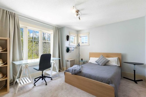 7 Discovery Ridge Cove Sw, Calgary, AB - Indoor Photo Showing Bedroom