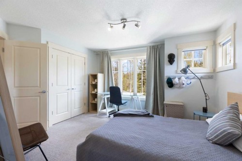7 Discovery Ridge Cove Sw, Calgary, AB - Indoor Photo Showing Bedroom