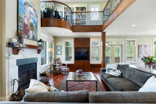 7 Discovery Ridge Cove Sw, Calgary, AB - Indoor Photo Showing Living Room With Fireplace