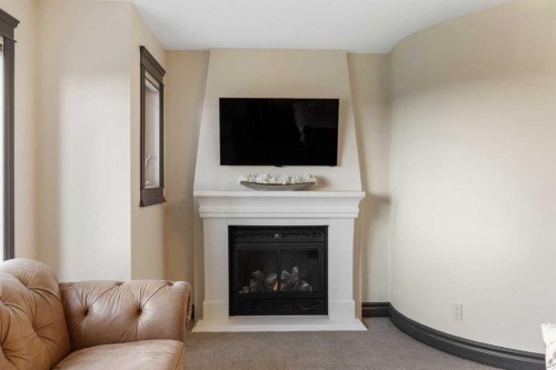 11 Timberline Gate Sw, Calgary, AB - Indoor Photo Showing Living Room With Fireplace