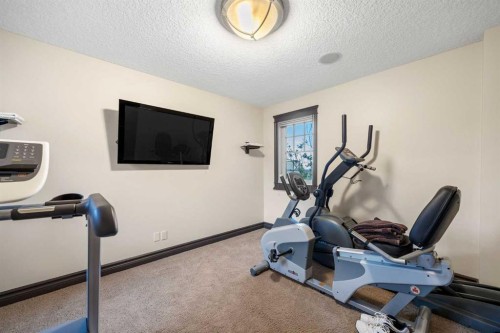 11 Timberline Gate Sw, Calgary, AB - Indoor Photo Showing Gym Room