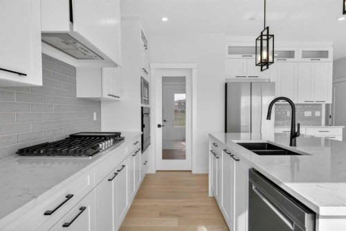14 Ranchers Meadows, Okotoks, AB - Indoor Photo Showing Kitchen With Double Sink With Upgraded Kitchen