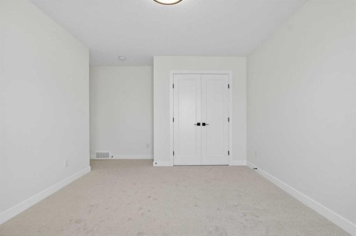 14 Ranchers Meadows, Okotoks, AB - Indoor Photo Showing Other Room