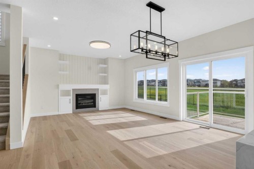 14 Ranchers Meadows, Okotoks, AB - Indoor Photo Showing Living Room With Fireplace