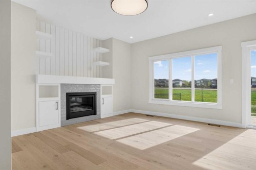 14 Ranchers Meadows, Okotoks, AB - Indoor Photo Showing Living Room With Fireplace