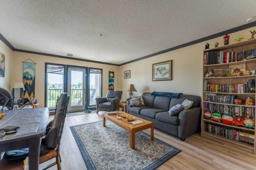 303-300 Edwards Way Nw, Airdrie, AB - Indoor Photo Showing Living Room