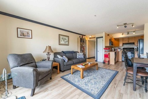 303-300 Edwards Way Nw, Airdrie, AB - Indoor Photo Showing Kitchen With Double Sink