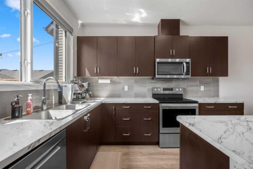149 Belmont Boulevard Sw, Calgary, AB - Indoor Photo Showing Kitchen With Double Sink