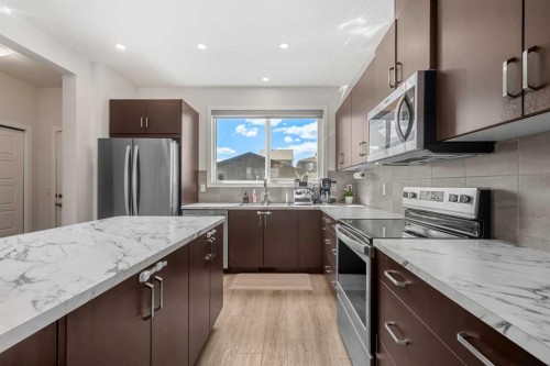 149 Belmont Boulevard Sw, Calgary, AB - Indoor Photo Showing Kitchen With Double Sink With Upgraded Kitchen