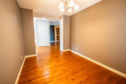 50 Panamount View Nw, Calgary, AB - Indoor Photo Showing Living Room With Fireplace