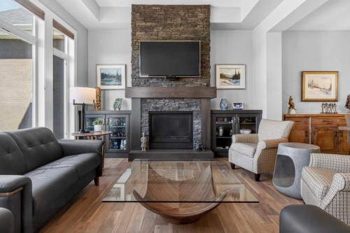 233 Spring Water Close, Heritage Pointe, AB - Indoor Photo Showing Living Room With Fireplace