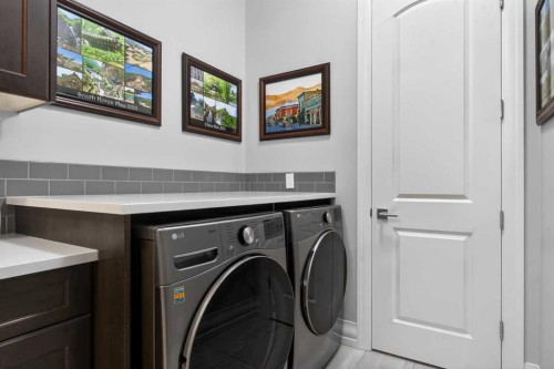 233 Spring Water Close, Heritage Pointe, AB - Indoor Photo Showing Laundry Room