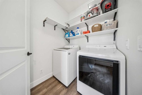 54 Elgin Meadows Green Se, Calgary, AB - Indoor Photo Showing Laundry Room
