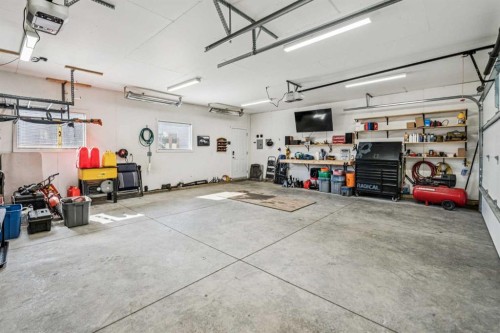 54 Elgin Meadows Green Se, Calgary, AB - Indoor Photo Showing Garage