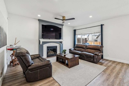 54 Elgin Meadows Green Se, Calgary, AB - Indoor Photo Showing Living Room With Fireplace