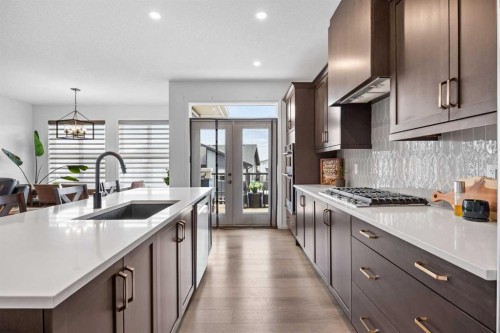 224 Precedence Hill, Cochrane, AB - Indoor Photo Showing Kitchen With Upgraded Kitchen