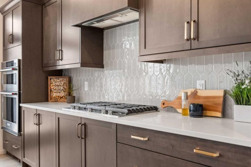 224 Precedence Hill, Cochrane, AB - Indoor Photo Showing Kitchen With Upgraded Kitchen