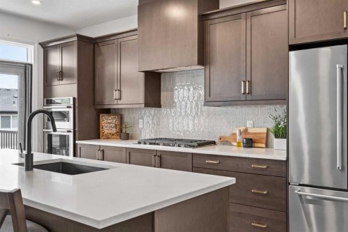 224 Precedence Hill, Cochrane, AB - Indoor Photo Showing Kitchen With Upgraded Kitchen