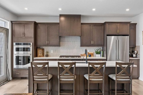 224 Precedence Hill, Cochrane, AB - Indoor Photo Showing Kitchen With Upgraded Kitchen
