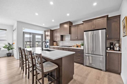 224 Precedence Hill, Cochrane, AB - Indoor Photo Showing Kitchen With Upgraded Kitchen