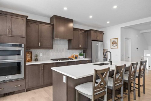 224 Precedence Hill, Cochrane, AB - Indoor Photo Showing Kitchen With Upgraded Kitchen