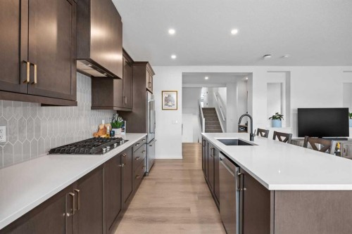 224 Precedence Hill, Cochrane, AB - Indoor Photo Showing Kitchen With Upgraded Kitchen