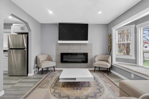 2414 27 Street Se, Calgary, AB - Indoor Photo Showing Living Room With Fireplace