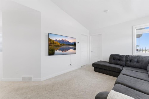 936 Langholm Drive Se, Airdrie, AB - Indoor Photo Showing Living Room