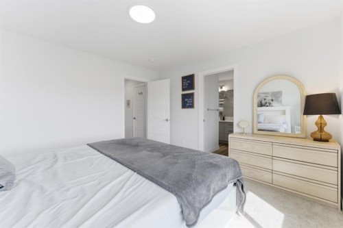936 Langholm Drive Se, Airdrie, AB - Indoor Photo Showing Bedroom