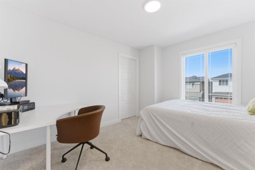 936 Langholm Drive Se, Airdrie, AB - Indoor Photo Showing Bedroom