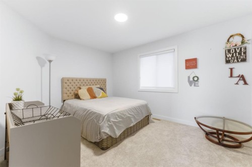 936 Langholm Drive Se, Airdrie, AB - Indoor Photo Showing Bedroom