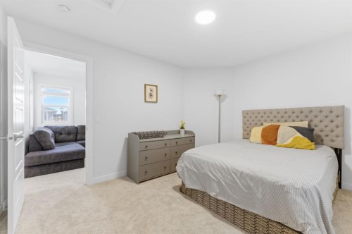 936 Langholm Drive Se, Airdrie, AB - Indoor Photo Showing Bedroom