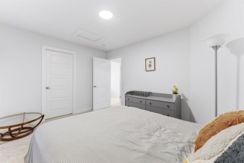936 Langholm Drive Se, Airdrie, AB - Indoor Photo Showing Bedroom