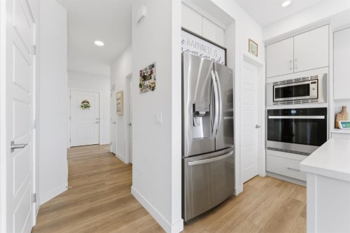 936 Langholm Drive Se, Airdrie, AB - Indoor Photo Showing Kitchen