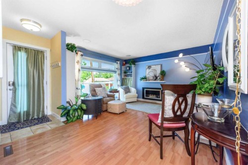 208 Van Horne Crescent Ne, Calgary, AB - Indoor Photo Showing Living Room With Fireplace