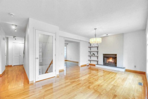 37 Shawbrooke Bay Sw, Calgary, AB - Indoor Photo Showing Living Room With Fireplace