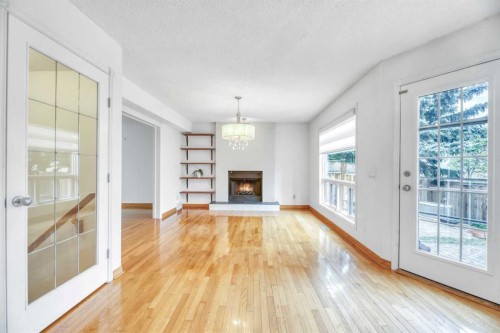 37 Shawbrooke Bay Sw, Calgary, AB - Indoor Photo Showing Living Room With Fireplace