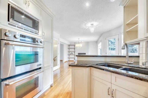 37 Shawbrooke Bay Sw, Calgary, AB - Indoor Photo Showing Kitchen With Double Sink